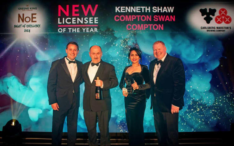 Kenny Shaw, second from left, picking up his award for The Swan at Compton. Credit: Greene King