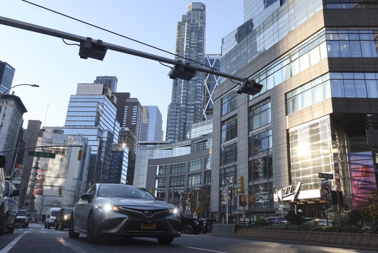 NEW YORK, NY – NOVEMBER 30: Congestion pricing toll readers hang above Broadway in Columbus Circle on November 30, 2023, in New York City.