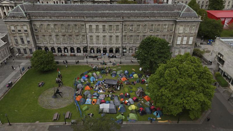 Students take part in an encampment protest over the Gaza conflict on the grounds of Trinity College in Dublin, Wednesday May 8, 2024. ©Niall Carson/PA via AP