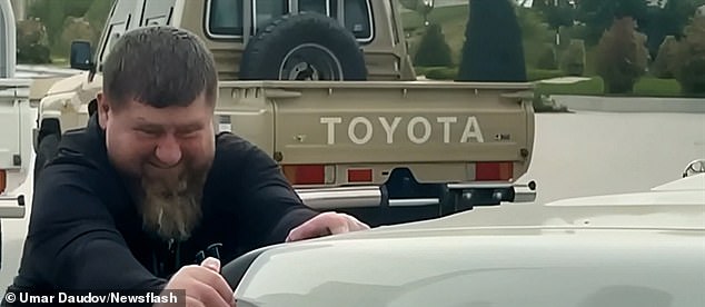 ramzan kadyrov filmed 'pulling truck' in bid to prove good health