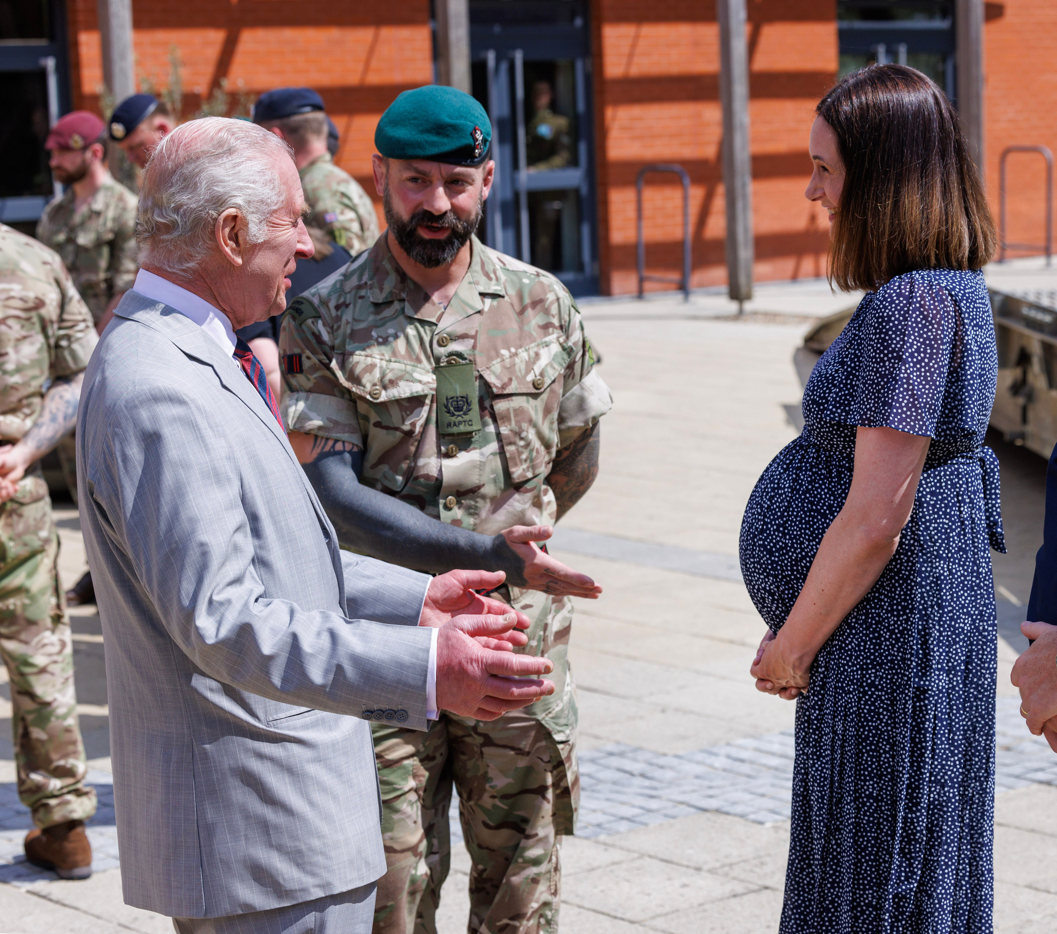 i’ve been allowed out of my cage, king charles quips on visit to barracks