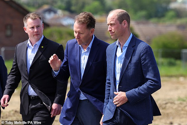 prince william on cornish surf beach playing volleyball