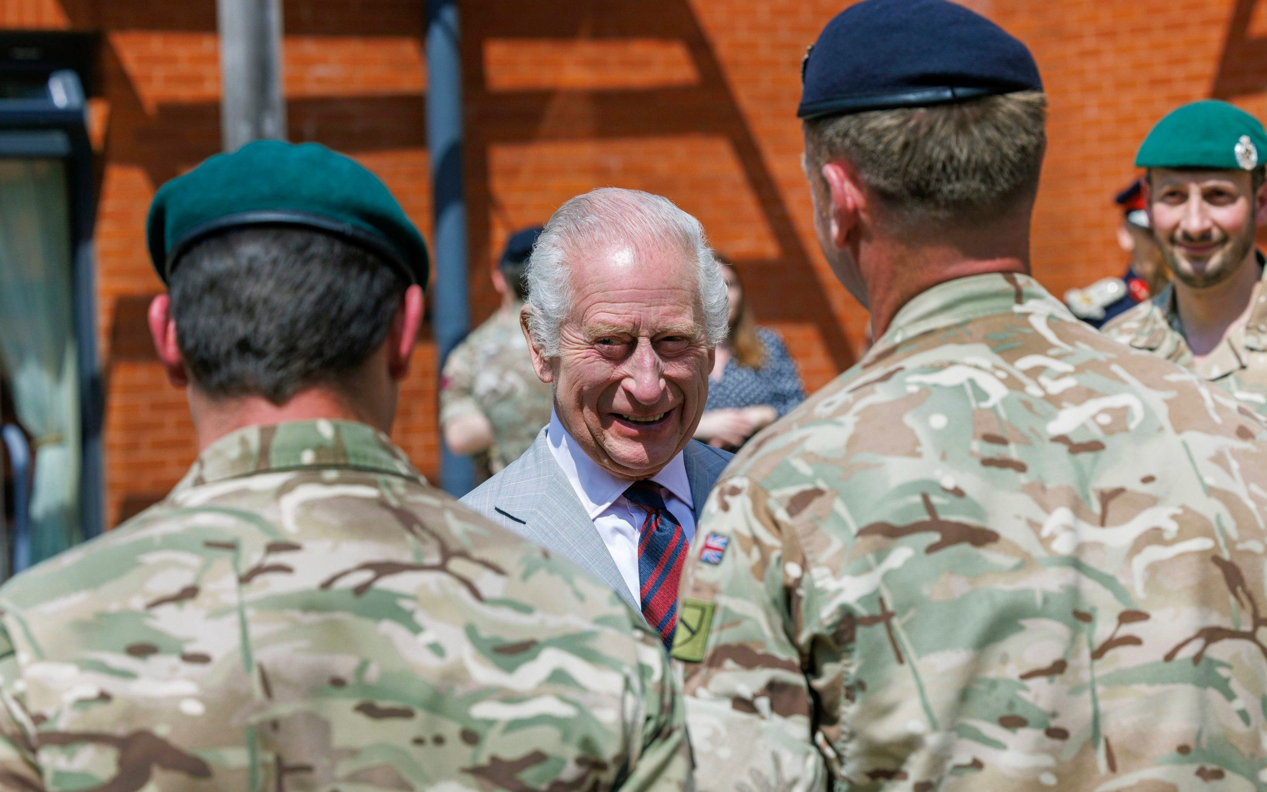 king ‘glad to be out of cage’ in first military visit since cancer diagnosis