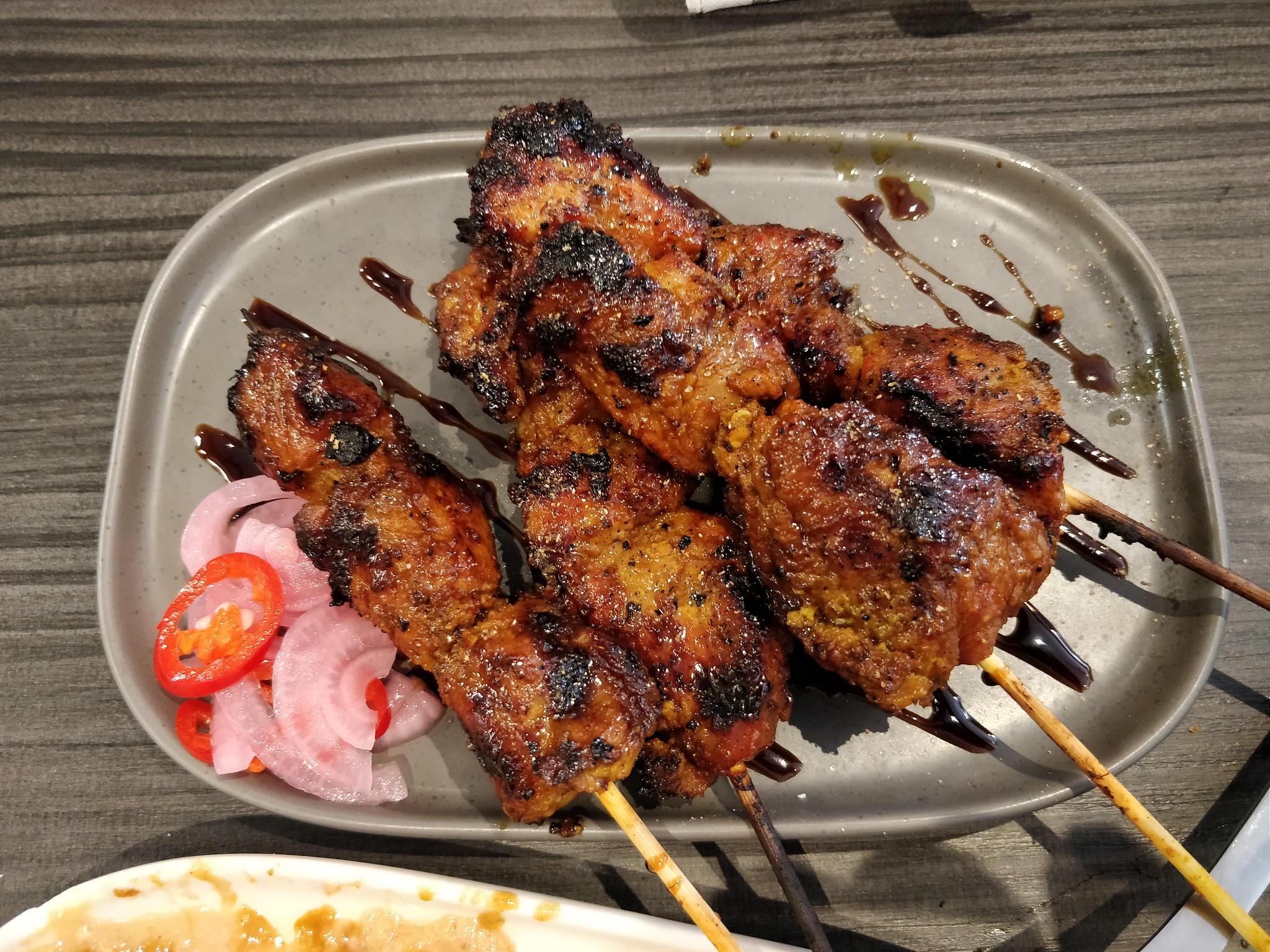 <p>The idea of pork satay skewers probably needs no introduction, but Disney serves them (if you know how to find them) in a delicious soy-ginger sauce, with a side of pickled-onion slaw. </p>