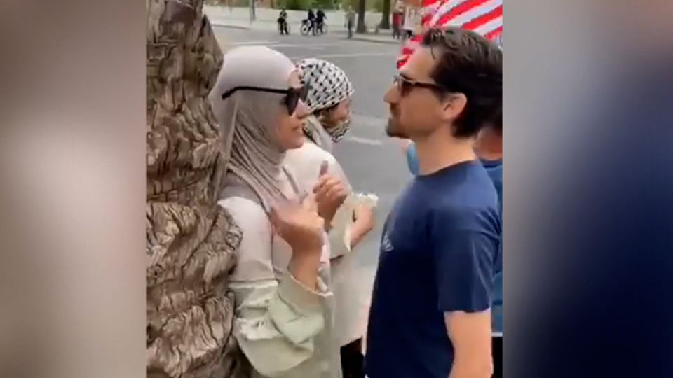 an arizona state university research scholar is on leave after video shows him verbally attacking a woman in a hijab