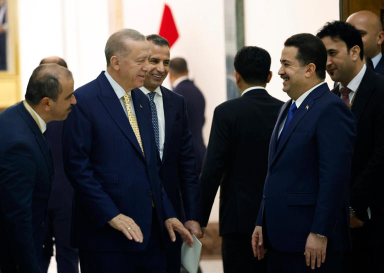 Turkish President Recep Tayyip Erdogan (second form left) and Iraqi Prime Minister Mohammed Shia al-Sudani (foreground right) attend the signing of cooperation in the Development Road project, in Baghdad. Photo: AP