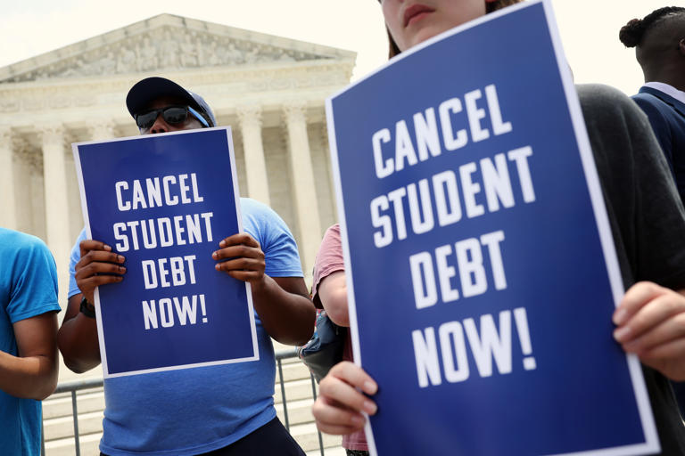 Student debt relief activists participate in a rally at the U.S. Supreme Court on June 30, 2023, in Washington, DC.