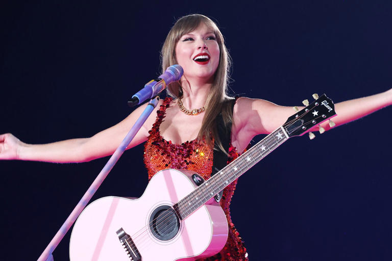 Kevin Mazur/TAS24/Getty Taylor Swift performs in Paris on May 9, 2024