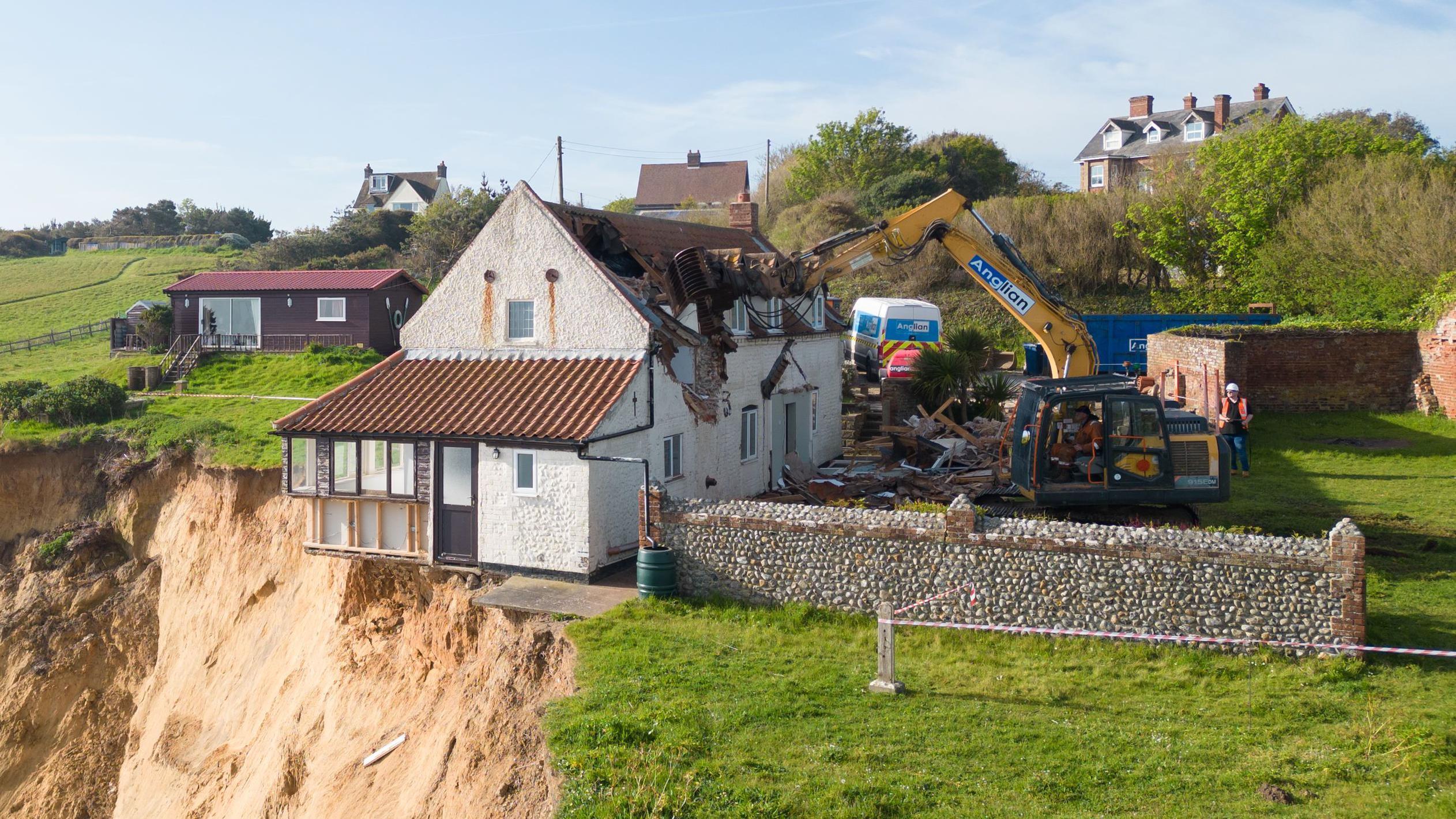 farmhouse teetering over cliff edge demolished