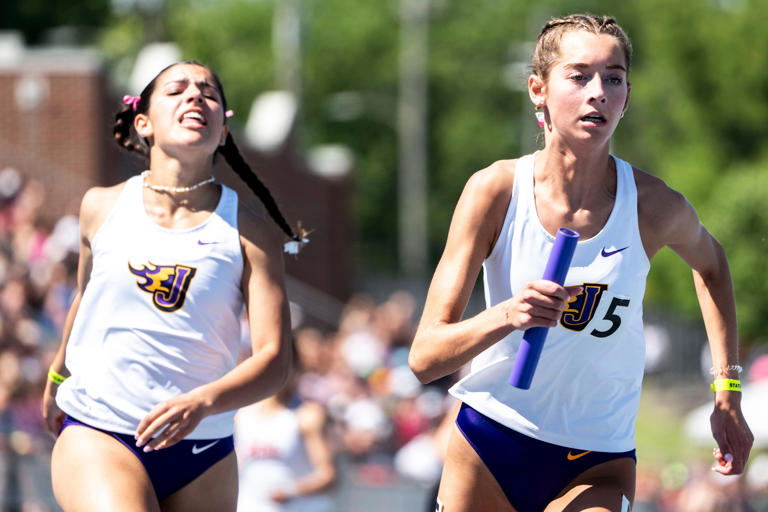 Johnston's Olivia Fehn, right, runs the 4A 1600 meter sprint medley relay during the Iowa high school state track and field meet at Drake Stadium on Friday, May 17, 2024, in Des Moines.
