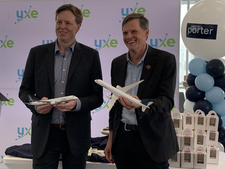 Porter Airlines Vice President Network Planning and Reporting Andrew Pierce, left, with Saskatoon Mayor Charlie Clark celebrating the start of regular Porter Airlines flights from Saskatoon to Toronto on May 16 2024.
