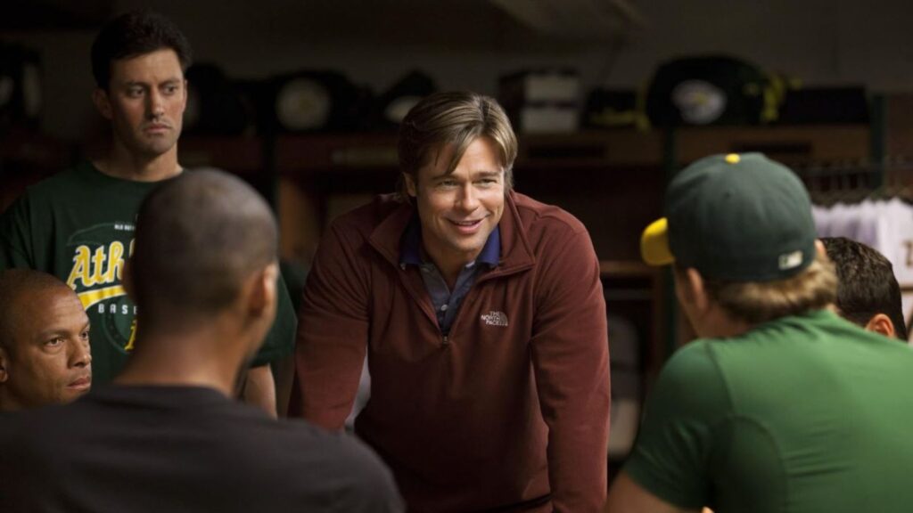 <p><em><span>Moneyball </span></em><span>takes a different route to hit you with the unfortunate truth about business life, which is that some of us will get screwed over no matter what we do. Not everyone can win this game, and that’s something you need to accept. The film is based on the baseball manager who revolutionized the game. The story follows a team that did not have enough money to spend on their players, so they found a different way to compete. It’s all about drive and innovation. </span></p>
