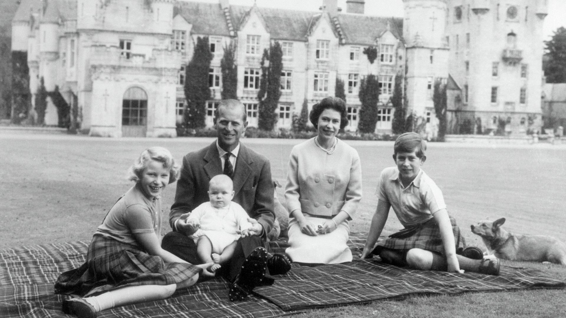 <p>                     The late Queen Elizabeth and Prince Philip famously had a love for the simpler things, being at their happiest when out and about at Balmoral and getting to be a regular family together.                   </p>                                      <p>                     In a sweet photo, the then family of five (Prince Edward wouldn't be born for another 12 years after this) posed in the grounds of Balmoral with huge grins - and joined by some of their family pets.                   </p>