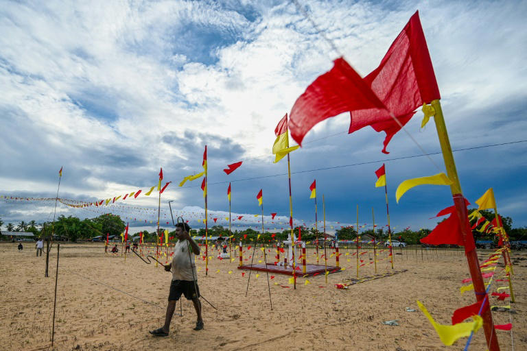 Volunteers prepare a venue on the eve of a commemoration ceremony at Mullivaikkal village in northern Sri Lanka on May 17, 2024