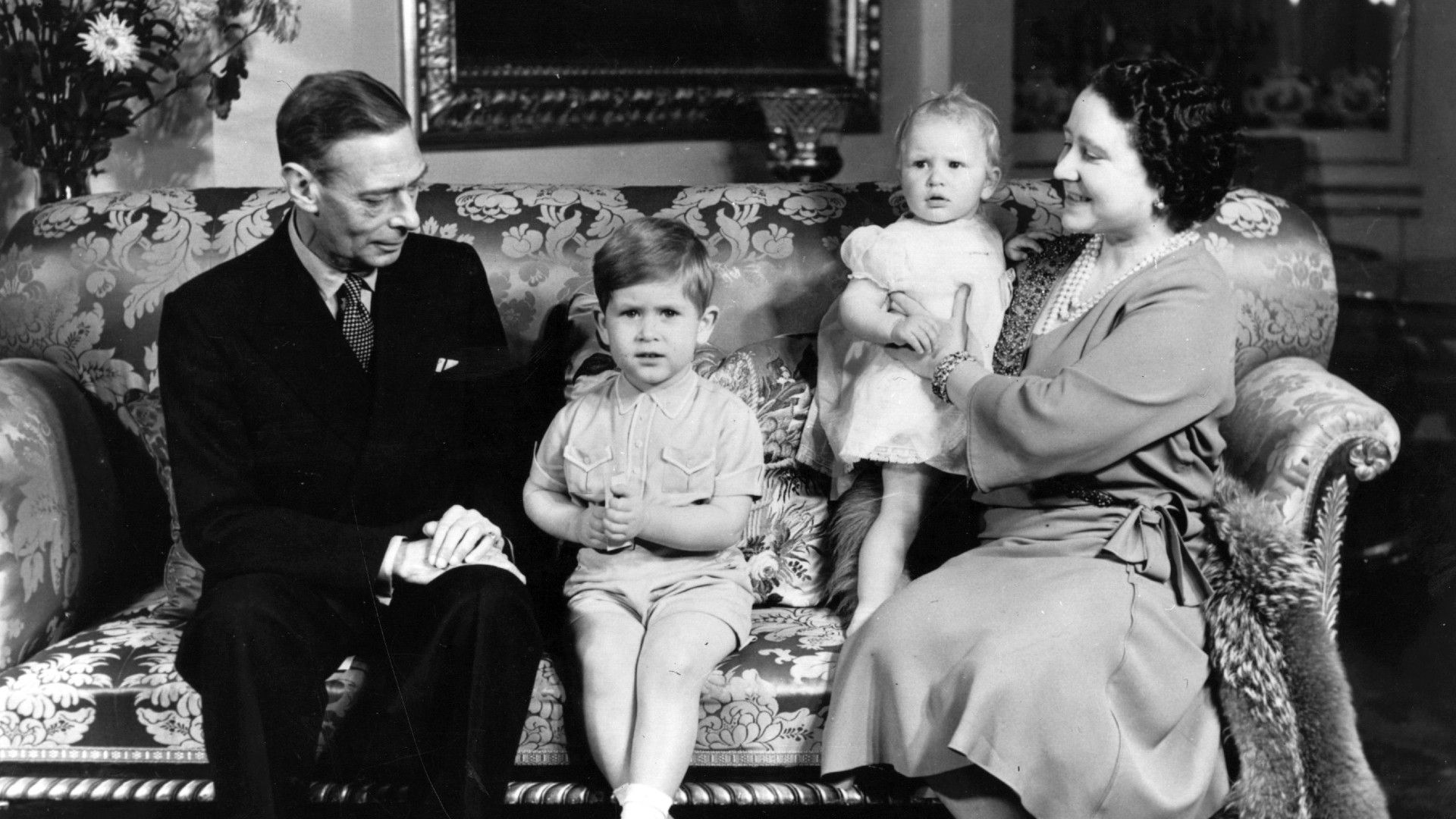 <p>                     In 1951, the Royal Family got together to celebrate the third birthday of Prince Charles. The first grandchild of King George VI and the Queen Mother, the pair look delighted to simply be playing the role of grandparents as they pose with Charles and his younger sister, Princess Anne.                   </p>                                      <p>                     This heart-warming photo becomes more special because it would be one of the last where the future King, Charles, got to sit for a photograph with his grandfather. George VI died in February 1952, three months later.                   </p>
