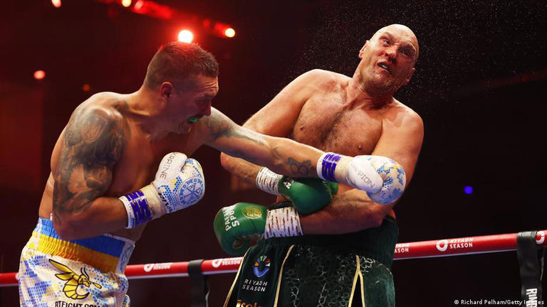 Usyk (left) is first boxer to earn the undisputed title since Lennox Lewis held the honor for five months in 1999 and 2000.