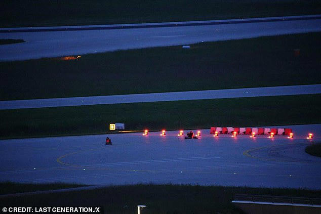 eco-warriors cause chaos by gluing themselves to munich airport runway