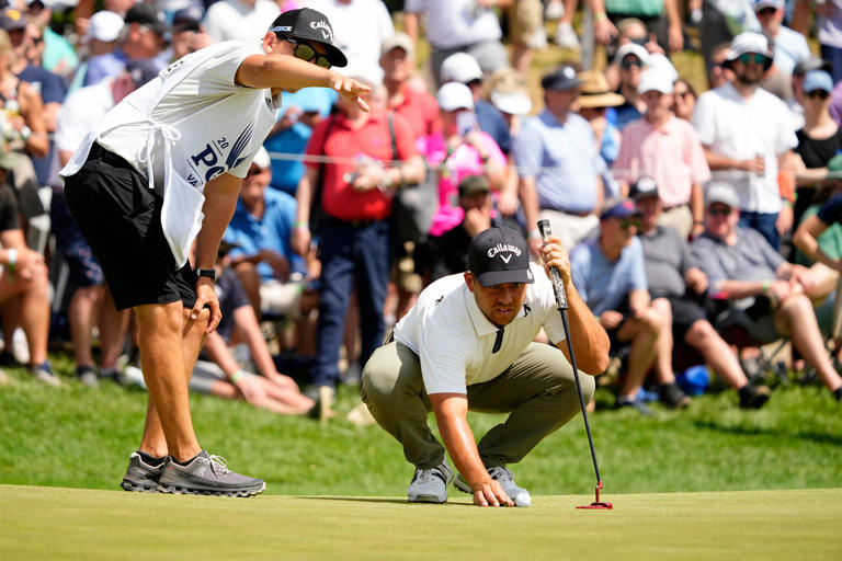 May 18, 2024; Louisville, Kentucky, USA; Xander Schauffele lines up a putt on the seventh green during the third round of the PGA Championship golf tournament at Valhalla Golf Club.