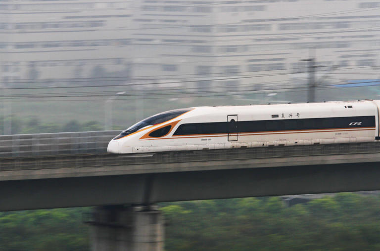 Stock photo showing the "Fuxing" bullet train running on the Beijing-Shanghai Railway in Changzhou in China's eastern Jiangsu province on September 21, 2017. China has the largest high-speed rail network in the world which already dwarfs proposals in the United States.