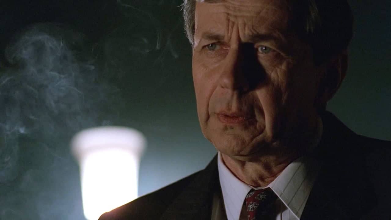 <p>Making his first appearance way back in<em> The X-Files</em>’ pilot episode, the Smoking Man always seemed like the spectral embodiment of forces beyond human understanding.</p><p>Conveying a sense of profound mystery without even having to utter a word, the Smoking Man personified the prevailing questions about the universe that plagued Fox Mulder and Dana Scully. Whenever he skulked through the background, viewers knew to expect some new conspiracy on the horizon.</p>