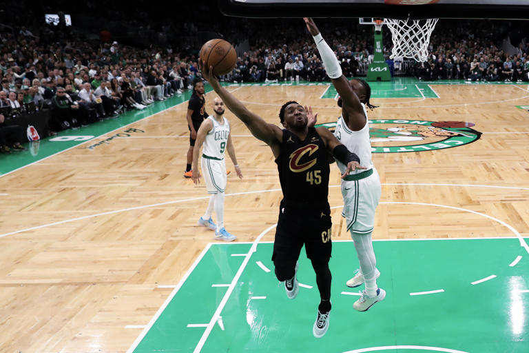 The Cleveland Cavaliers' Donovan Mitchell shoots the ball against the Boston Celtics' Jaylen Brown during the first half in Game 2 of the Eastern Conference second-round playoff series at TD Garden on Thursday, May 9, 2024, in Boston.