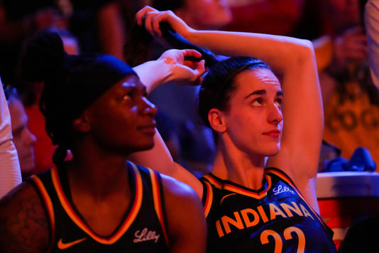 Indiana Fever guard Caitlin Clark (22) fixes her hair before the game, Thursday, May 16, 2024, during the Indiana Fever home opener game against the New York Liberty at Gainbridge Fieldhouse in Indianapolis. Grace Hollars/IndyStar / USA TODAY NETWORK