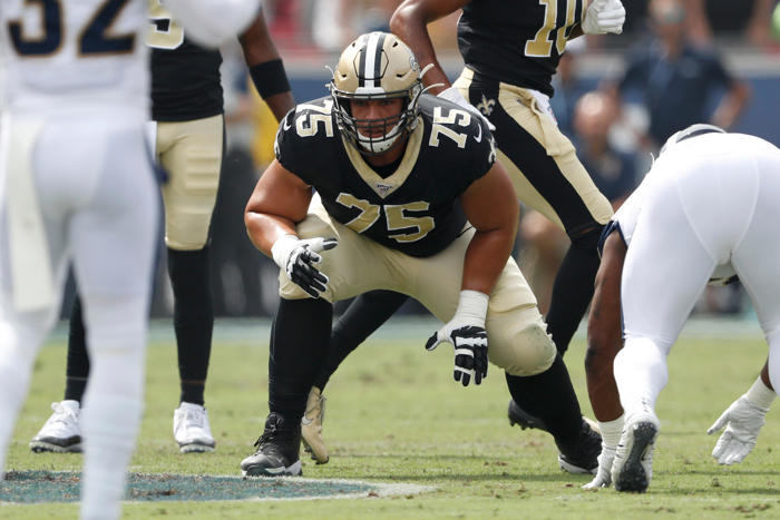 mickey loomis says saints made several attempts to re-sign andrus peat
