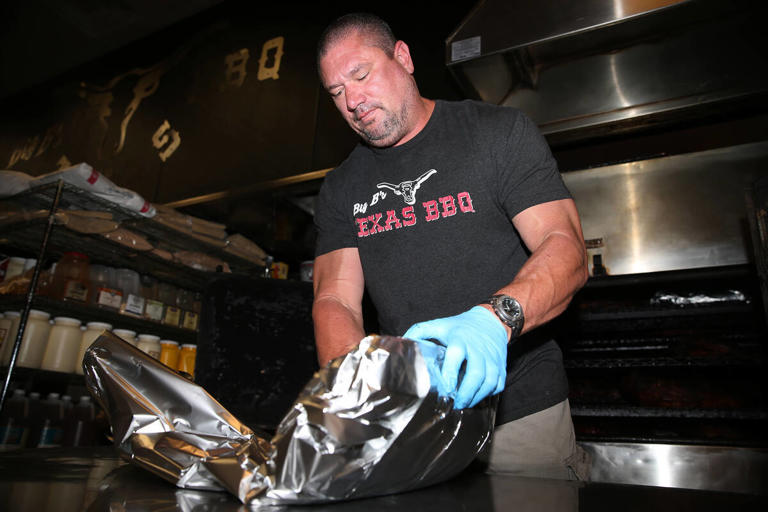 Brian Buechner, co-owner of Big B's Texas BBQ in Henderson, wraps a brisket at his restaurant, Saturday, June 22, 2019.