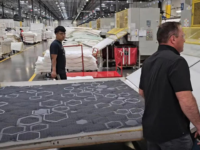 Here, you can see what the finished quilted mattress top looks like. On the right is 3Z Brands CEO John Merwin. I was impressed by his knowledge of every step of the mattress-making process. James Brains/Business Insider
