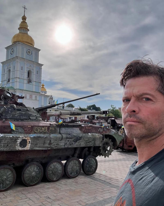 misha collins visits kyiv: supernatural star poses amidst destroyed russian equipment