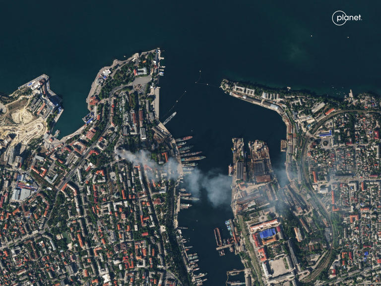 A satellite image shows smoke billowing from the port of Sevastopol, Crimea, September 22, 2023. Used for illustration purposes. PLANET LABS PBC/Handout via REUTERS