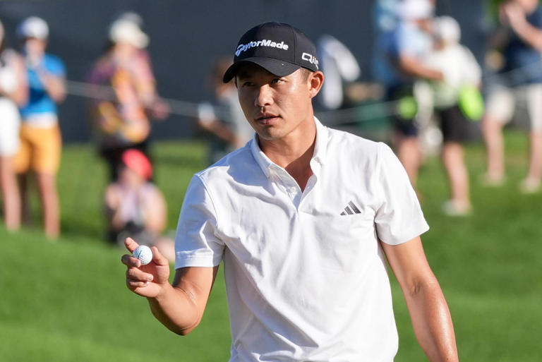 Collin Morikawa waves to the fans after making his putt on the 18th hole and finishing the third round of the PGA Championship tied in first place with Xander Schauffele at Valhalla Golf Club on Saturday, May 18, 2024.