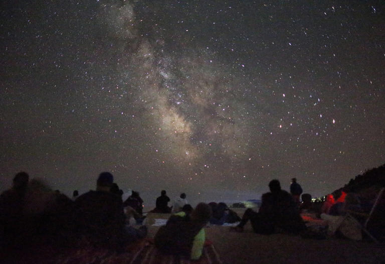 MOUNT DESERT ISLAND, ME - 8/3/2016: The Milky Way is visible over people attending a park ranger-led stargazing program on Sand Beach in Acadia National Park. The park offers a variety of educational programs for children and adults. (Timothy Tai for The Boston Globe)