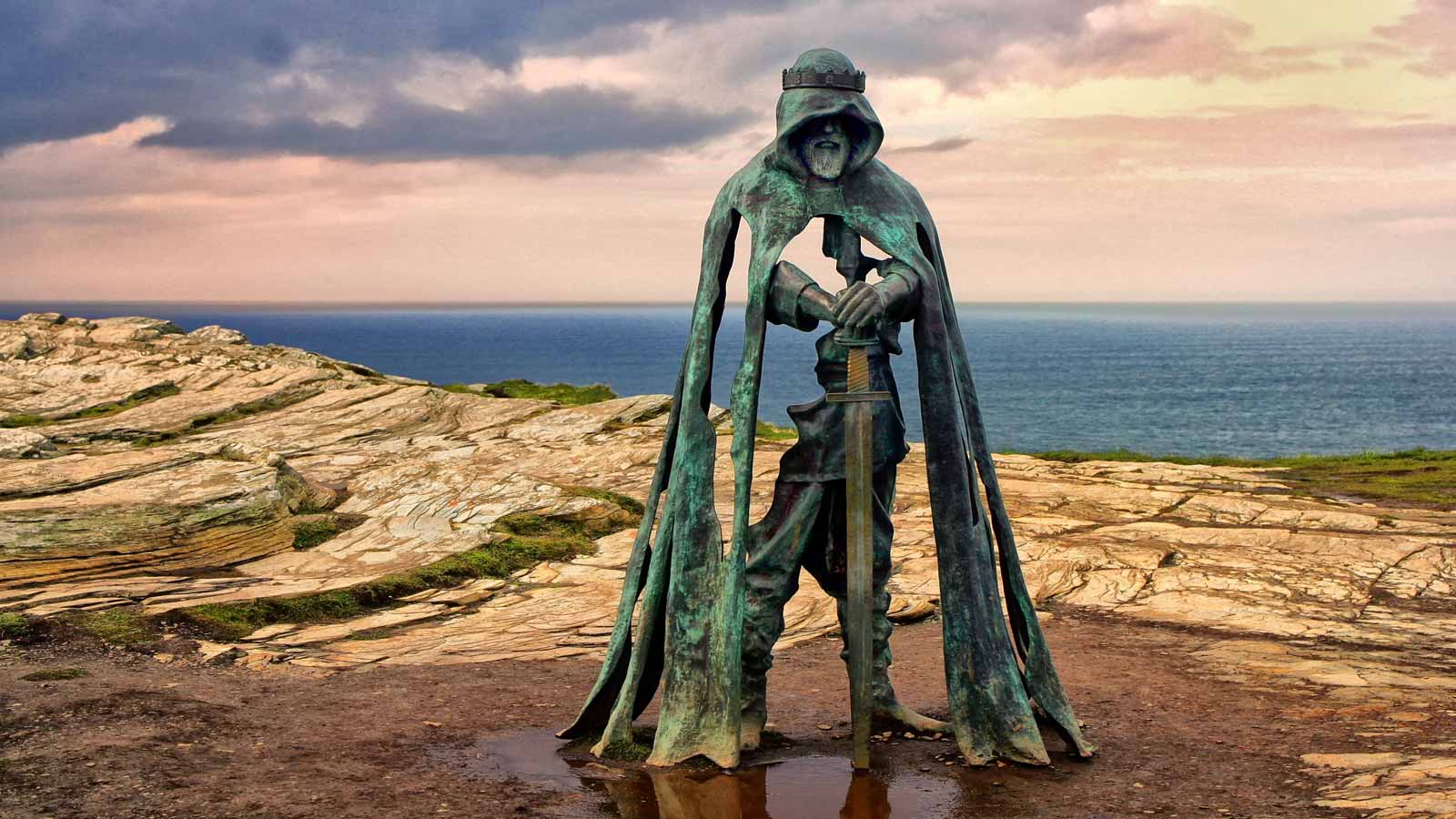 <p><span>Otherwise known as the Statue of King Arthur, the “Gallos” sculpture is at Tintagel Castle in North Cornwall, England. Artist Rubin Eynon created the 8-foot-tall bronze piece. </span></p><p><span>While it’s commonly associated with King Arthur, the ‘Gallos’ sculpture, according to its owner, English Heritage, does not represent a single individual. Instead, it serves as a testament to the rich history of the site it graces. North Cornwall, a believed summer retreat for the kings of Dumnonia, holds a significant place in England’s history.</span></p>