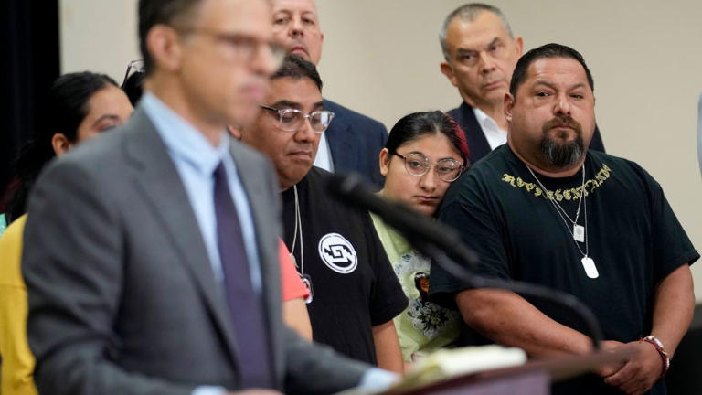 Javier Cazares, right, was among family members of the victims in the Uvalde school shooting who joined attorney Josh Koskoff, left, at a news conference on Wednesday.
