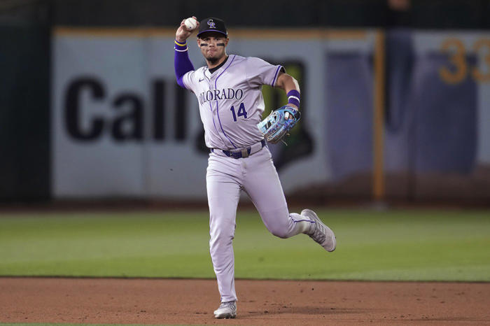 mcmahon hits 2-run homer in the 12th inning to lift colorado rockies over oakland athletics 4-3