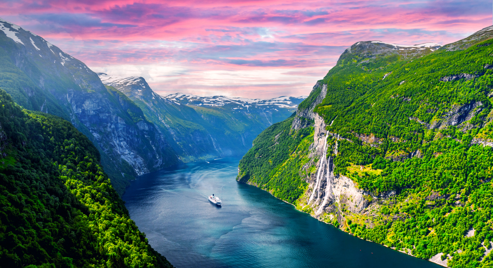 <p>Geirangerfjord is a stunning, deep-blue fjord in Norway, surrounded by majestic mountain peaks, 800-meter-high cliffs and cascading waterfalls. It is often dubbed, <em>“Nature’s Masterpiece.”</em></p>  <p>Another UNESCO World Heritage Site, it is an impressive 15 kilometers long and whopping 260 meters deep.</p>