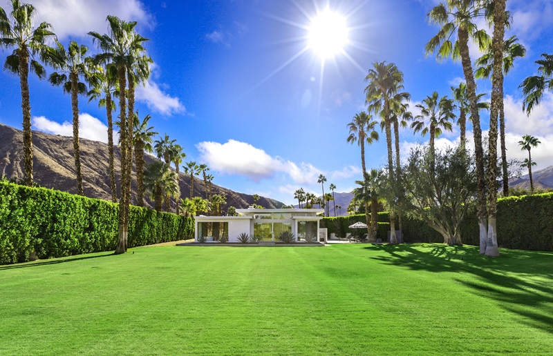<p>Given <a href="https://www.fancypantshomes.com/celebrity-homes/bob-hope-ufo-palm-springs-home-sells/">Palm Springs’s long history of famous residents</a>, you can barely throw a stone without hitting a glam former celebrity abode.</p> <p>This Indian Canyons home is no exception, and was once home to celebrated American actor Fess Parker, best known for his iconic roles as Davy Crockett and Daniel Boone.</p> <p>A true trophy property harking back to Palm Springs’s storied past, the Fess Parker Estate sits on a half-acre in the sought-after neighborhood of Indian Canyons, with a sprawling yard that leads visitors into the 2,097-square-foot abode with soaring ceilings, sliding glass walls and clerestory windows — that frame panoramic views of the majestic San Jacinto Mountains.</p> <p><em>“The yard is certainly the first thing that visitors to the home recognize — the size and beauty, with the mountains surrounding it — certainly are breathtaking,”</em> says<a href="https://www.compass.com/agents/tim-krubsack/" rel="noreferrer noopener"> listing agent Tim Krubsack</a> with Compass.</p> <p><em>“Inside, the primary bedroom suite is unlike any other. With a shower that is part of the room, and incredible views of the grounds, it’s an experience that no other home can offer. Finally, the walls of glass make this a true Palm Springs residence.” </em></p>