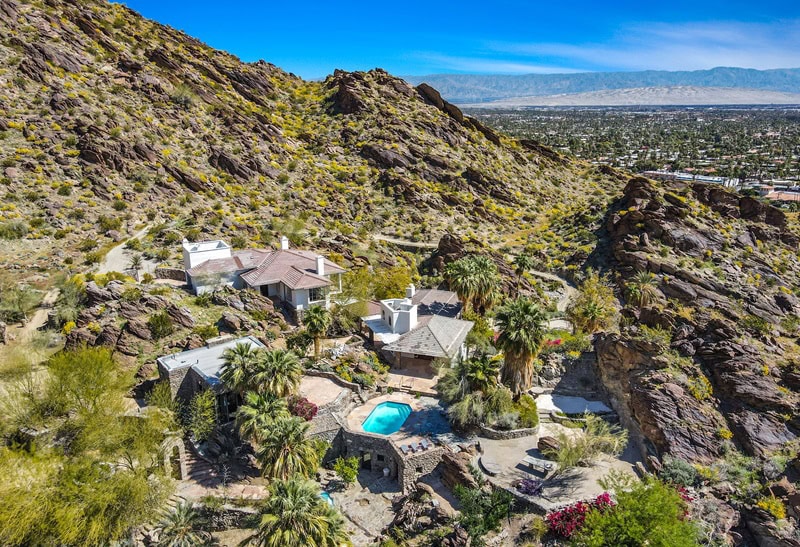 <p>Encapsulating everything that Palm Springs is best known for — celebrity pedigree, desert hideaway vibes, and distinctive architecture — <a href="https://www.fancypantshomes.com/celebrity-homes/suzanne-somers-beloved-28-acre-palm-springs-retreat/">Suzanne Somers’ legendary Palm Springs retreat</a> is looking for new owners.</p> <p>Set in the scenic outskirts of Downtown Palm Springs, the property is a sprawling 28-acre compound with several distinct structures totaling 7,280 square feet — and all the bells and whistles you’d expect from the desert hideaway of an iconic TV darling.</p> <p>Listed for $8.95 million, the compound consists of a European-inspired main house, four guest villas, and an Albert Frey-designed guest house. It also has some fairly unique features, like a custom funicular that takes guests all the way up to the residence.</p>