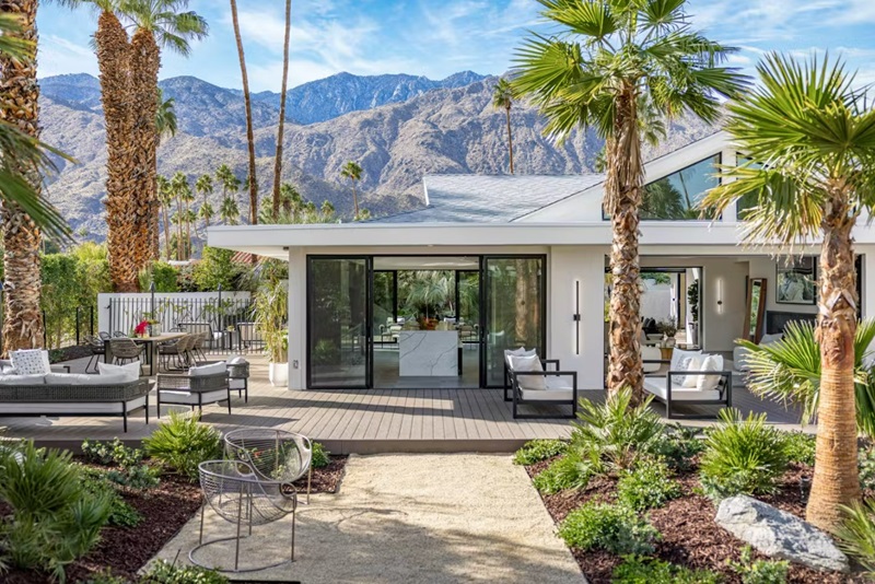 <p>Originally designed in the 1970s by Howard Lapham, one of the modernist architects who helped shape Palm Springs, this 4-bedroom home has been reimagined from the ground up by design-build company TED Construction.</p> <p>Set in the desirable Deepwell Estates community — where Tippi Hedren and Jerry Lewis once lived — the 4-bedroom, 6-bath home has been designed with the more tropical side of Palm Springs living in mind.</p> <p>As such, it comes with some fairly unique features like pocketing walls of glass and a dramatic 14′ ceiling vault in the great room, an all-season lanai, attached casita, over 3,000 square feet of decking that wraps the home and pool, and a dynamic landscape design that makes use of the entire property. It’s <a href="https://www.compass.com/listing/1195-manzanita-avenue-palm-springs-ca-92264/1502403872247097793/" rel="noreferrer noopener">currently listed for $4,188,000</a> with James Gault and Scott Ehrens at Compass.</p>