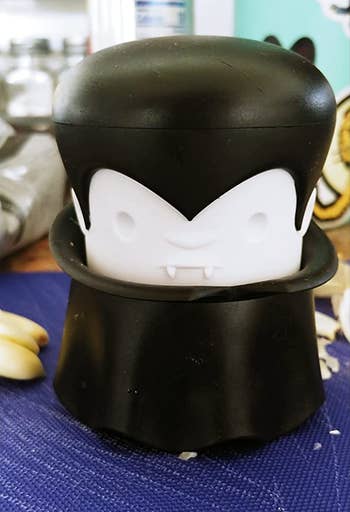 The garlic crusher sitting on a counter