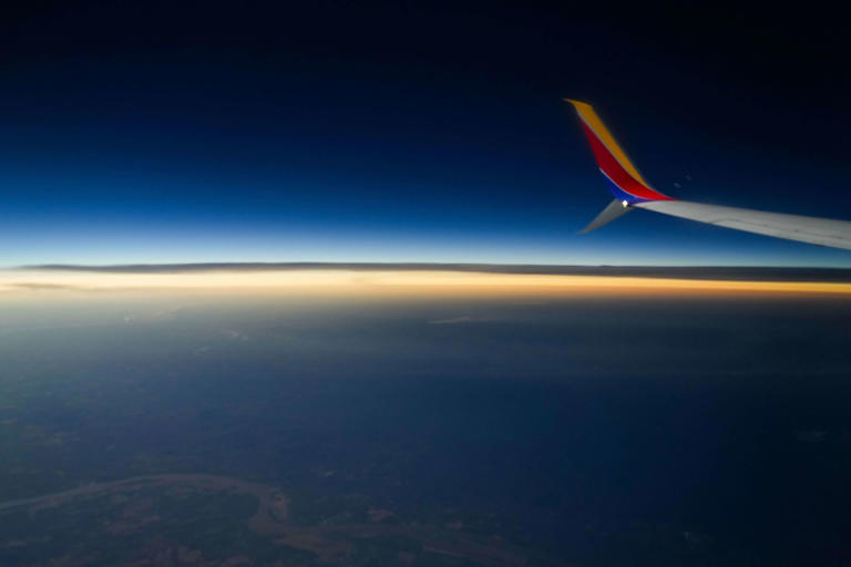 The colors of sunset stretch to the horizon during a total solar eclipse as seen from Southwest Airlines flight #1252 from Dallas to Pittsburgh on Monday, April 8, 2024.