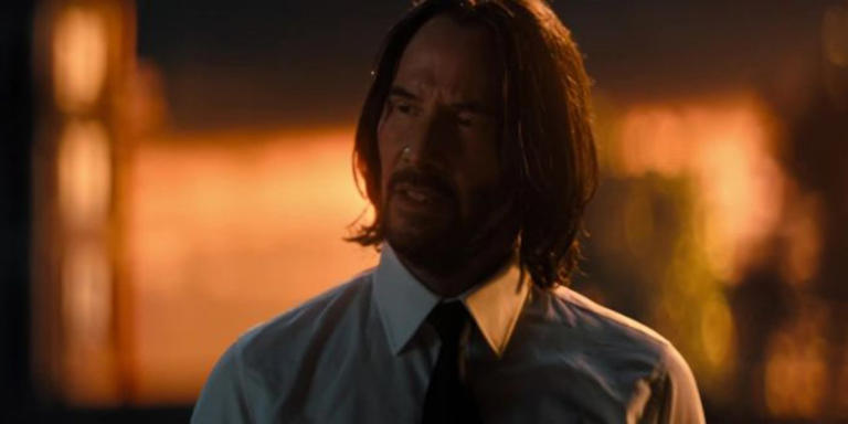 Keanu Reeves as John Wick Looking Concerned in John Wick Chapter 4