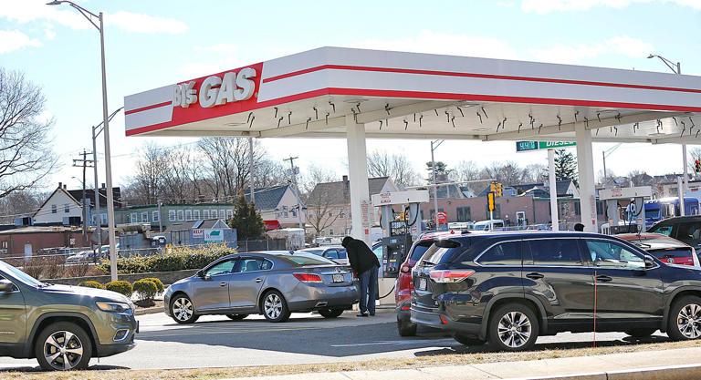 Drivers line up for gas at the BJ's Club gas station in Quincy on Tuesday, March 8, 2022.