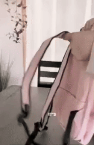 reviewer converting a pink backpack into a stool
