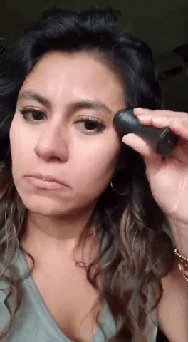 Reviewer using Revlon oil-absorbing volcanic face roller