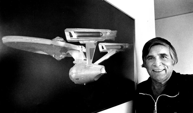 Gene Roddenberry, creator of "Star Trek," with an image of the starship Enterprise in 1984. ((Ken Lubas / Los Angeles Times))