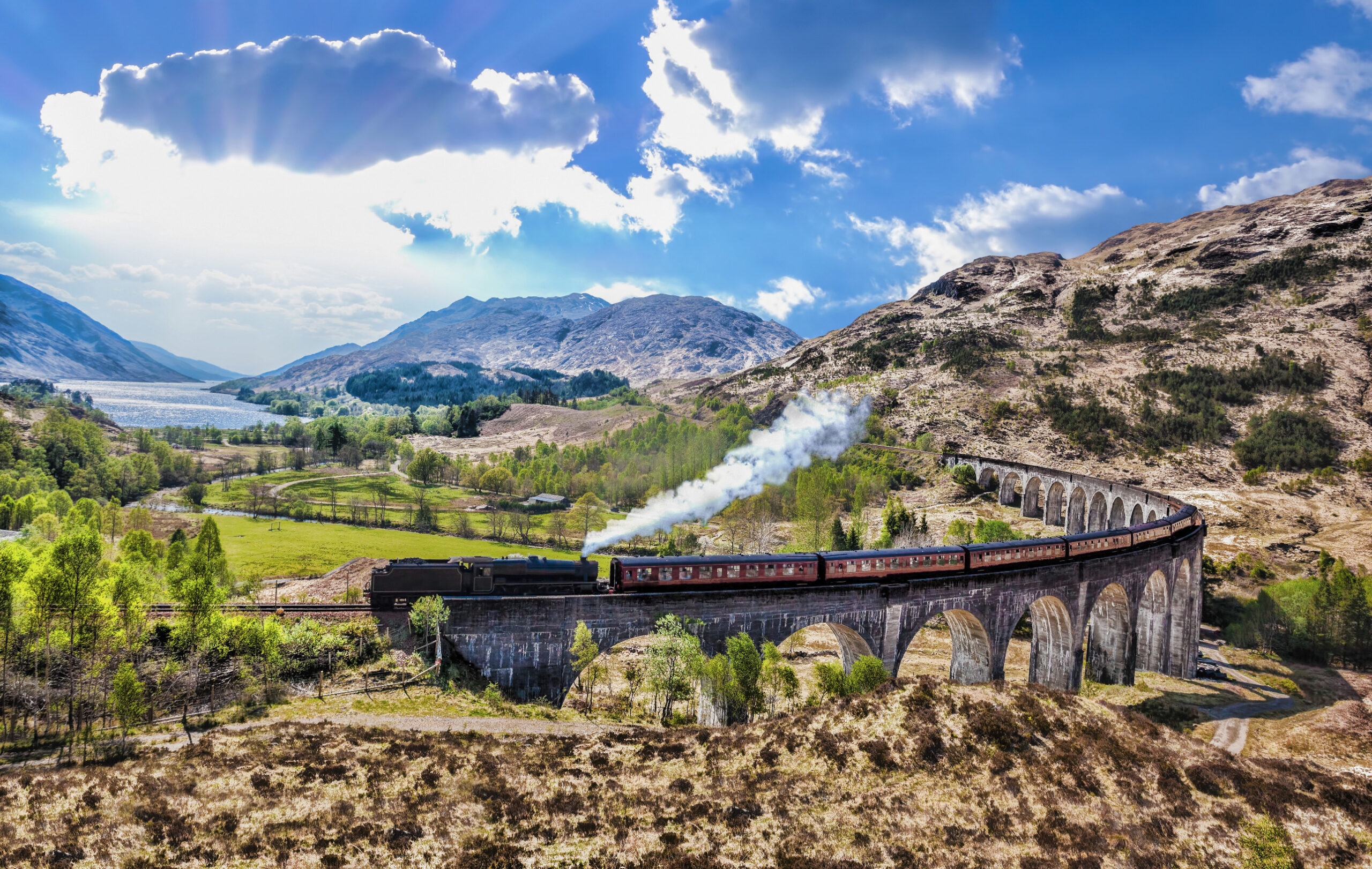 <p>Harry Potter fans, rejoice! The Jacobite Steam Train in Scotland offers a magical journey through the <a href="https://travel.usnews.com/Scottish_Highlands_Scotland/Things_To_Do/">Scottish Highlands,</a> and considered one of the most scenic train journeys around the world. This historic train ride will transport you to a world of rolling hills, shimmering lochs, and the iconic Glenfinnan Viaduct – instantly recognizable from the movies. Whether you’re a die-hard wizarding enthusiast or simply love a good steam train adventure, the Jacobite promises a truly enchanting experience that will leave you feeling a bit magical. For an extra dose of nostalgia, consider booking afternoon tea service onboard for a classic British experience.</p>
