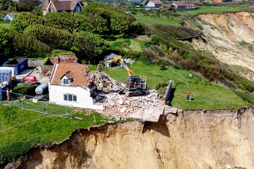 heartbreak as 18th century farmhouse left hanging over perilous cliff edge is demolished
