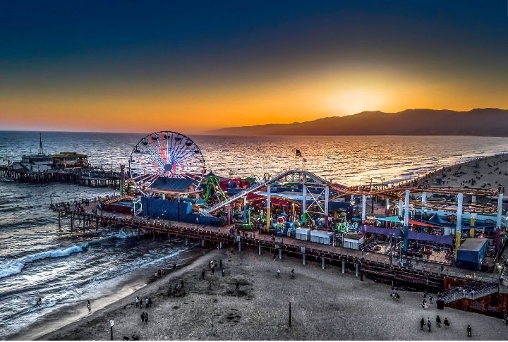 <p>The Santa Monica Pier, an iconic landmark in Southern California, has a rich history and vibrant atmosphere. Opened in 1909, it offers attractions like the Pacific Park amusement park, featuring a Ferris wheel and roller coaster. The pier is also home to shops and street performers, making it a popular destination for tourists and locals.</p>